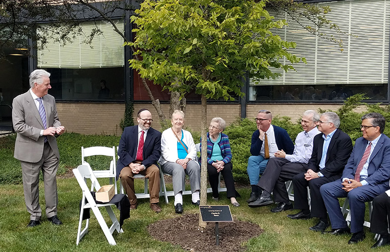 Memorial tree planting in honor of the late Charles R. Bauer