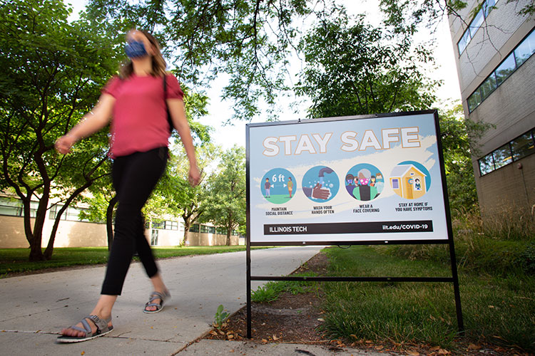 Colorful signage reminding the Illinois Tech community of best health practices can be found all around Mies Campus.